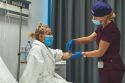 One of the dedicated nurses preparing the patient for surgery